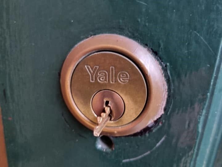 Broken key extraction on brass Yale rim cylinder fitted to green wooden door